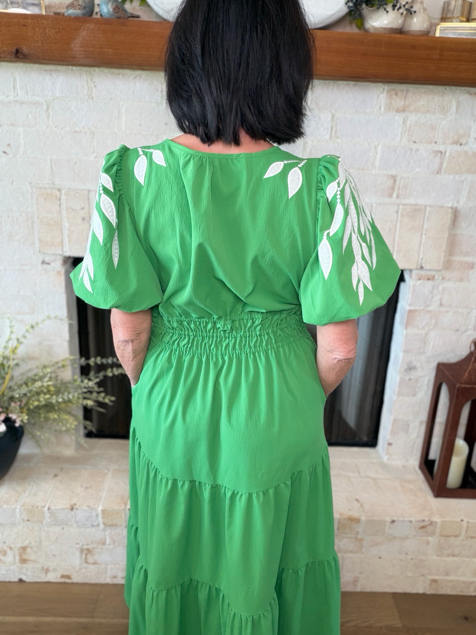 Green Maxi Dress With Floral Accents On Sleeves