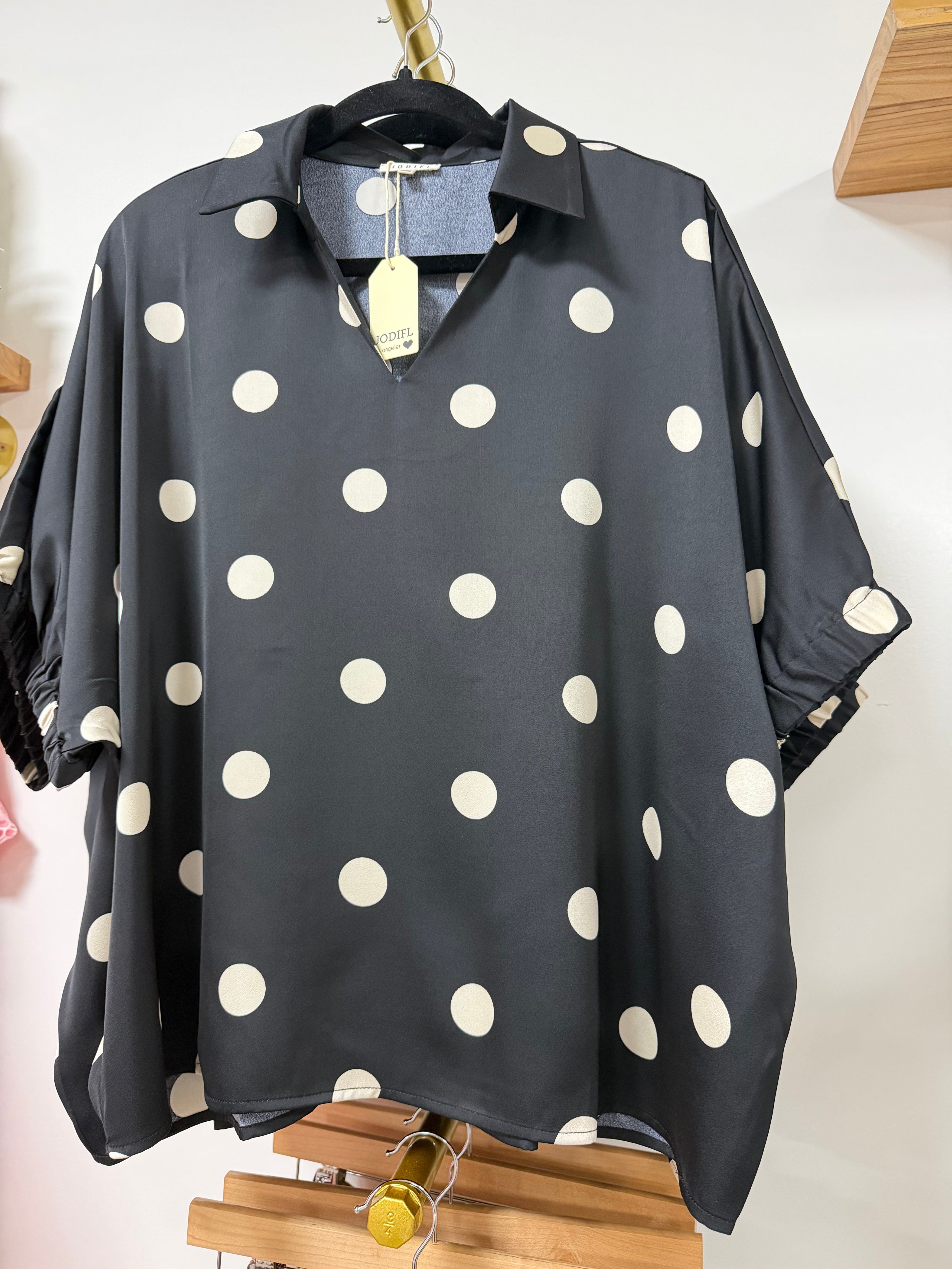 Black polka dot top