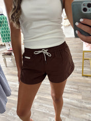 Soft woven lined athletic shorts with zipper coin pocket