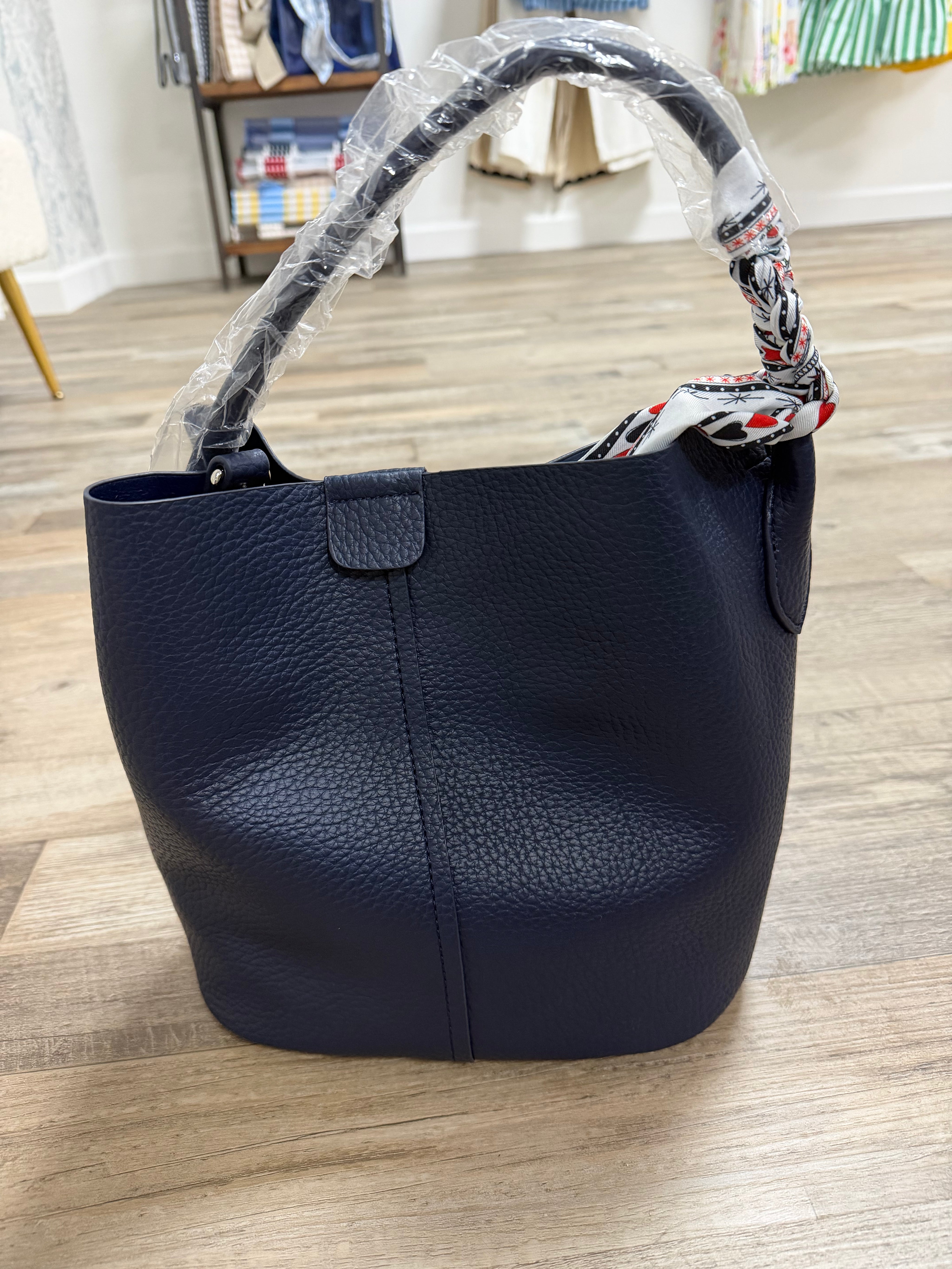 Blue bag with scarf wrapped  handle